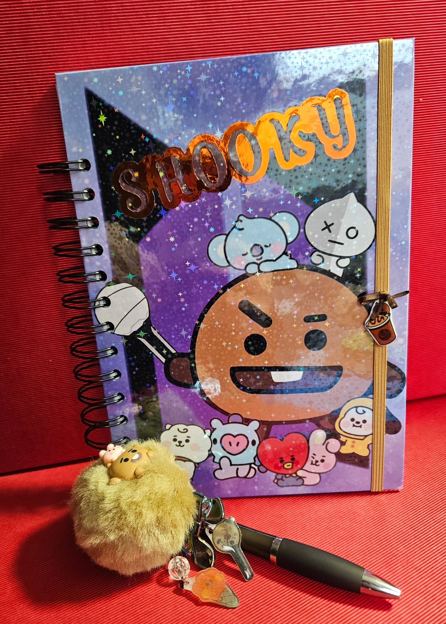 Cuaderno A5 +boligrafo Shooky