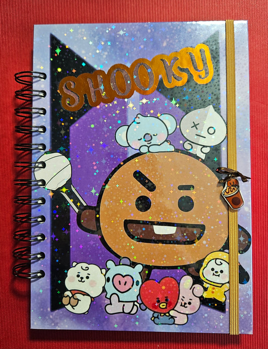 Cuaderno A5 +boligrafo Shooky